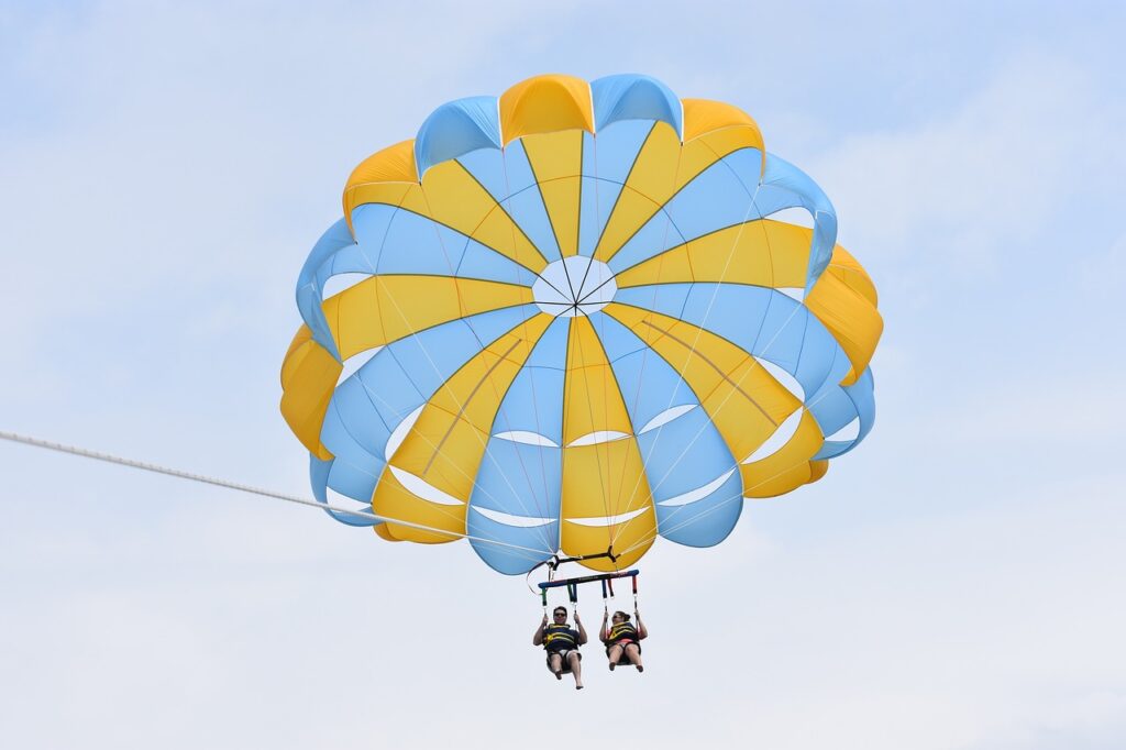 Parasailing is a fantastic summer activity to enjoy on a calm afternoon. 